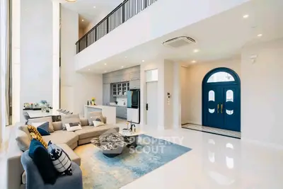 Luxurious modern living room with high ceilings and elegant decor