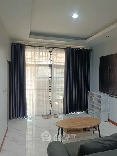 Modern living room with elegant curtains and sleek furniture design
