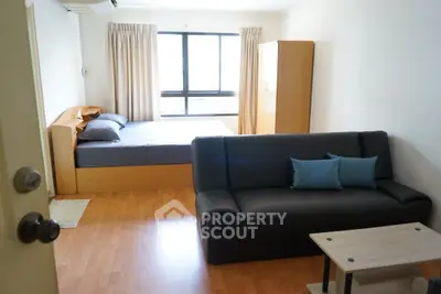 Cozy bedroom with modern furnishings and natural light