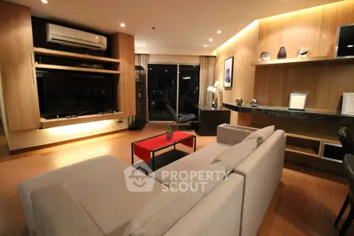 Luxurious modern living room with stylish decor and ambient lighting, perfect for relaxation and entertainment.