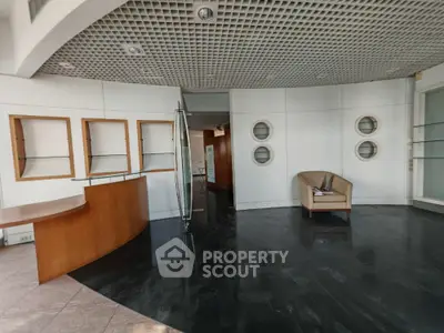 Modern office lobby with sleek design and stylish seating area