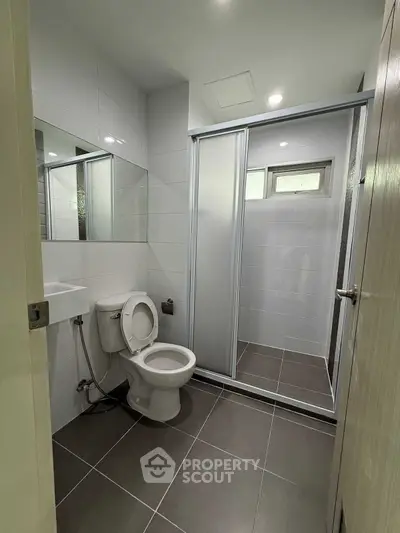 Modern bathroom with sleek design and glass shower enclosure