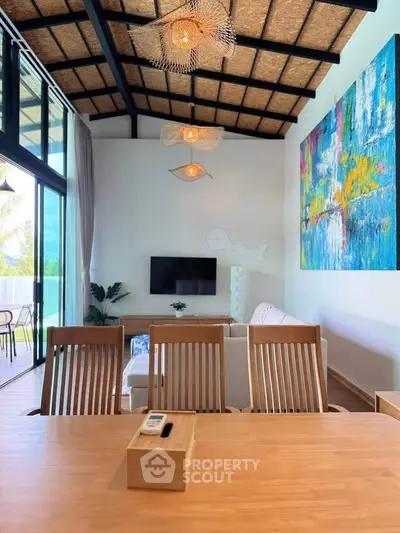 Stunning modern living room with high ceilings and vibrant artwork