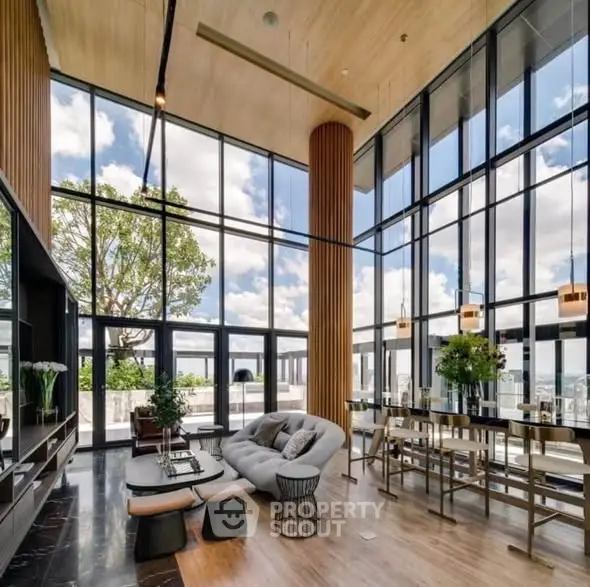 Luxurious modern living room with floor-to-ceiling windows and stunning city view