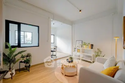 Bright and modern living room with stylish decor and natural light