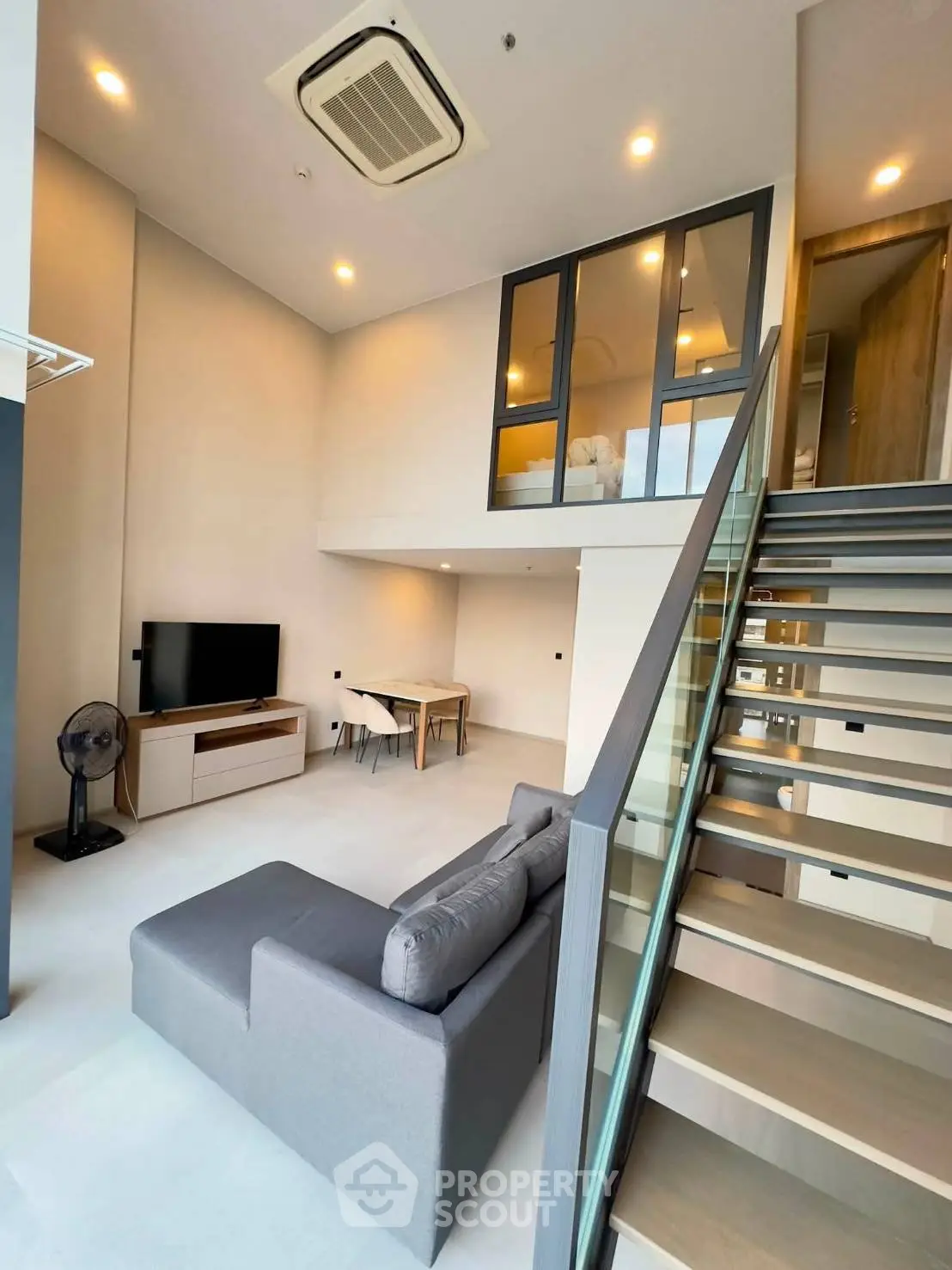 Modern loft apartment with stylish living room and mezzanine bedroom