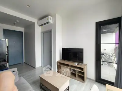 Modern living room with sleek furniture and balcony access in a stylish apartment.