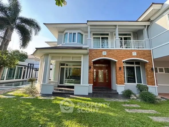 Stunning two-story house with lush garden and modern architecture