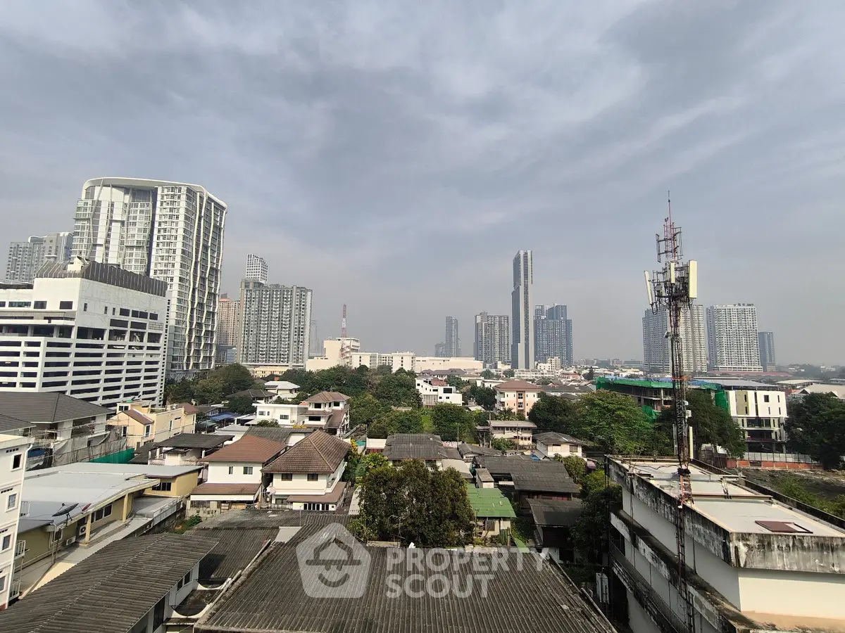 Stunning cityscape view showcasing modern high-rise buildings and lush greenery, perfect for urban living.