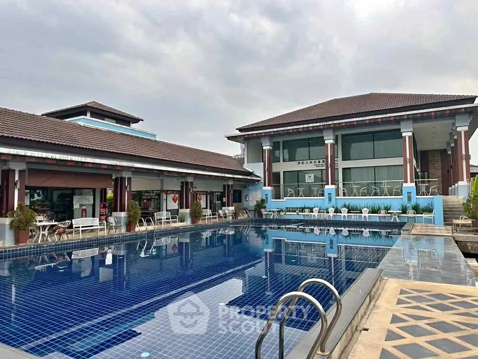 Luxurious residential complex with stunning outdoor pool and modern architecture.