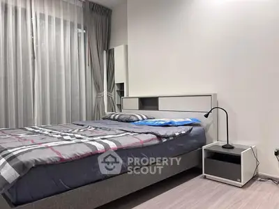 Modern bedroom with stylish decor and natural light