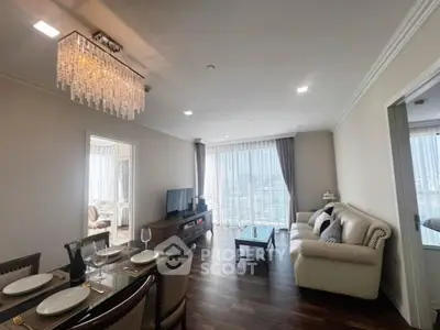 Luxurious living room with elegant chandelier and panoramic city view