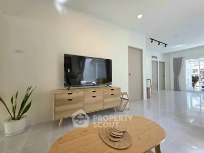 Spacious modern living room with sleek furniture and natural light