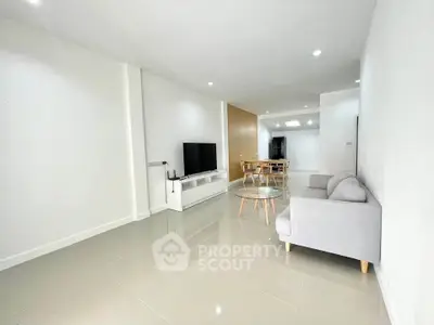 Spacious modern living room with sleek furniture and open layout