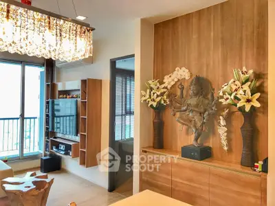 Luxurious living room with elegant decor and stunning chandelier in modern apartment.
