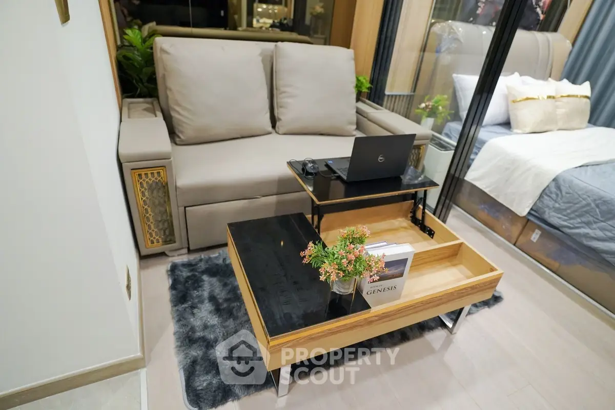 Modern living room with stylish sofa and coffee table in cozy apartment