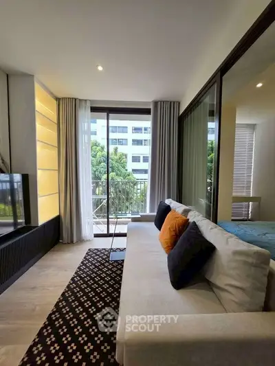 Modern living room with stylish decor and balcony view in urban apartment