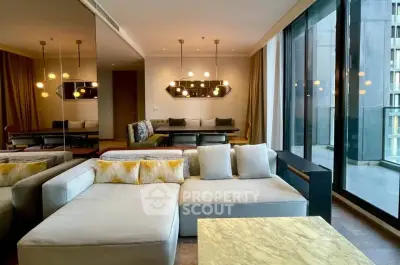 Luxurious modern living room with floor-to-ceiling windows and elegant lighting