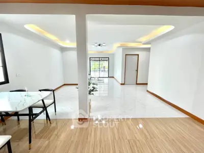 Spacious modern living room with elegant ceiling lights and open layout