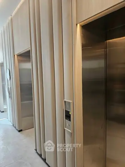 Modern building elevator lobby with sleek design and ambient lighting