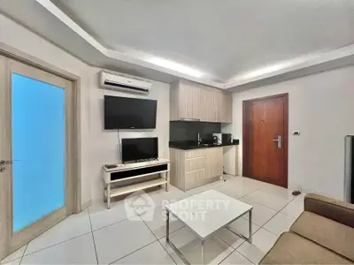Modern living room with sleek design and integrated kitchen area