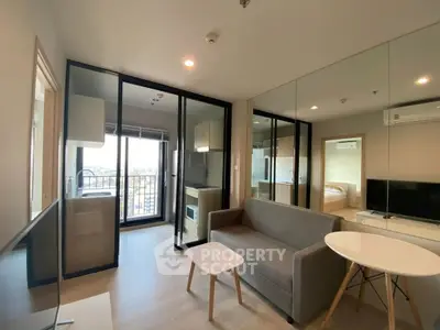 Modern living room with balcony and mirrored wall in a stylish apartment