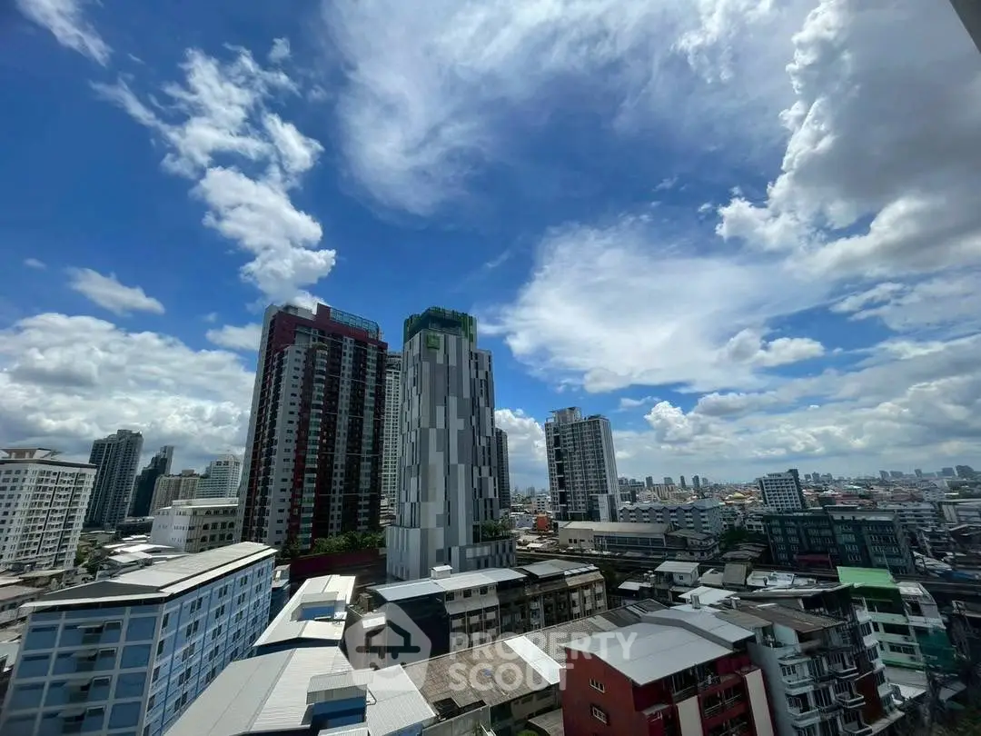 Stunning cityscape view with modern high-rise buildings under a vibrant blue sky.
