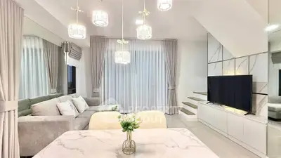 Elegant modern living room with stylish lighting and cozy seating area