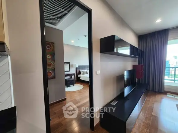 Modern apartment interior with sleek living room and bedroom view