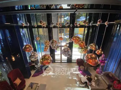 Luxurious modern living room with stunning chandelier and floor-to-ceiling windows