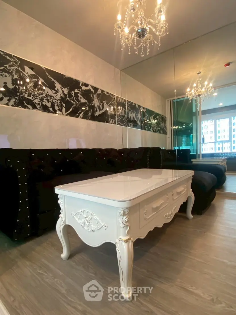 Luxurious living room with elegant chandelier and stylish decor