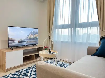 Modern living room with stylish decor and large window view