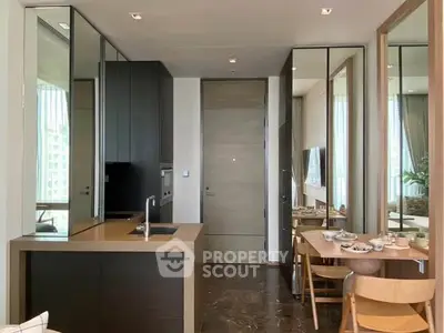 Modern kitchen with sleek design and dining area in luxury apartment