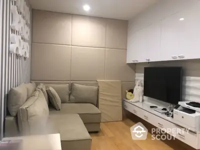 Modern living room with cozy sectional sofa and sleek entertainment unit