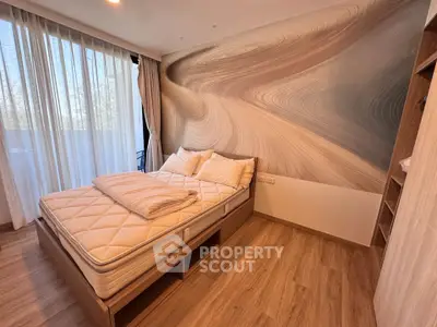Modern bedroom with stylish wall design and natural light