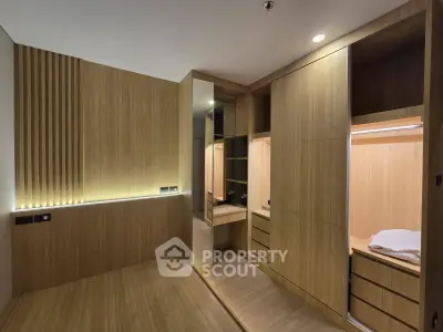 Luxurious modern bedroom with sleek wooden built-in wardrobes and ambient lighting