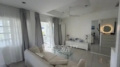 Spacious modern living room with glass coffee table and elegant decor