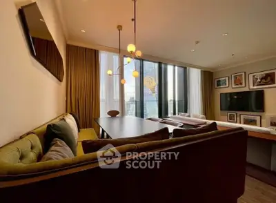 Stylish living room with modern decor and large windows offering city view.