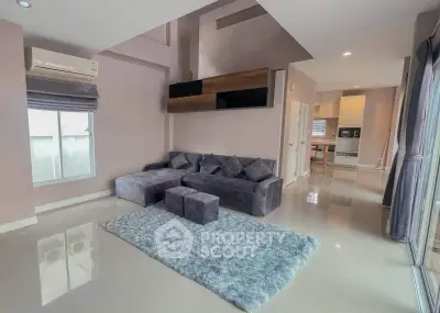 Spacious modern living room with plush sofa and sleek design