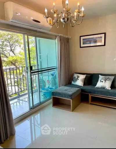 Bright living room with balcony access and modern decor in a stylish apartment.