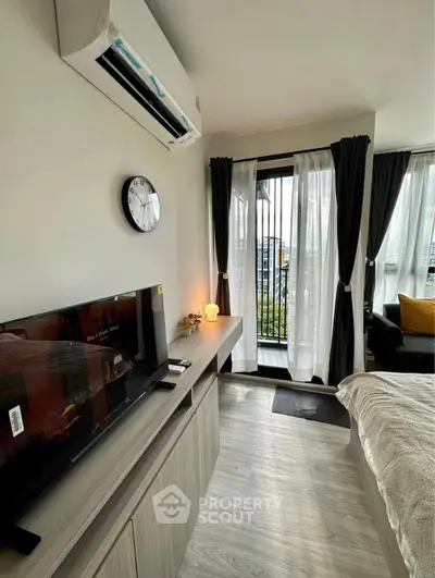 Modern bedroom with balcony access and stylish decor