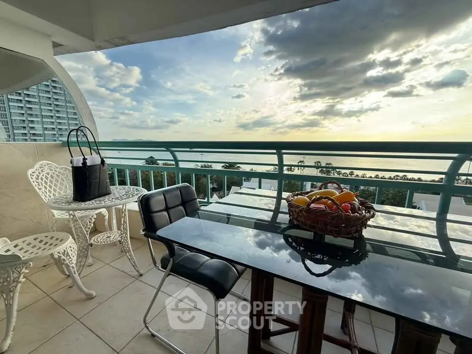 Stunning balcony with ocean view and elegant outdoor seating.