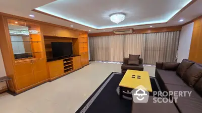 Spacious living room with elegant furniture and built-in entertainment center