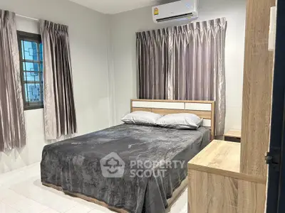 Modern bedroom with stylish decor and natural light