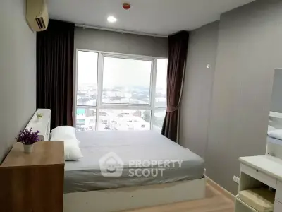 Modern bedroom with large window offering city view, featuring minimalist decor and cozy ambiance.