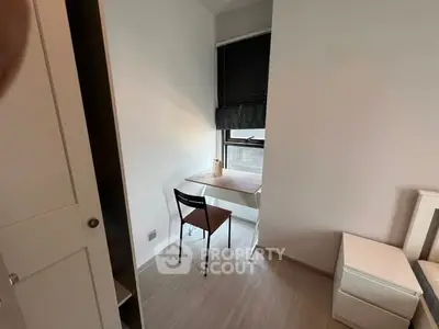 Cozy study nook with natural light and minimalist design in modern apartment.