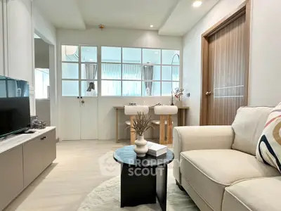 Modern living room with cozy sofa and stylish decor in open layout apartment
