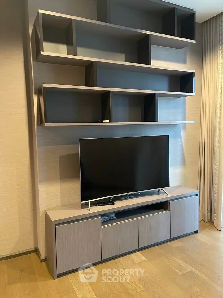 Modern living room with sleek TV stand and stylish shelving unit, perfect for contemporary home decor.