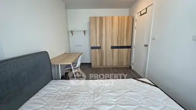 Modern bedroom with stylish wardrobe and cozy workspace