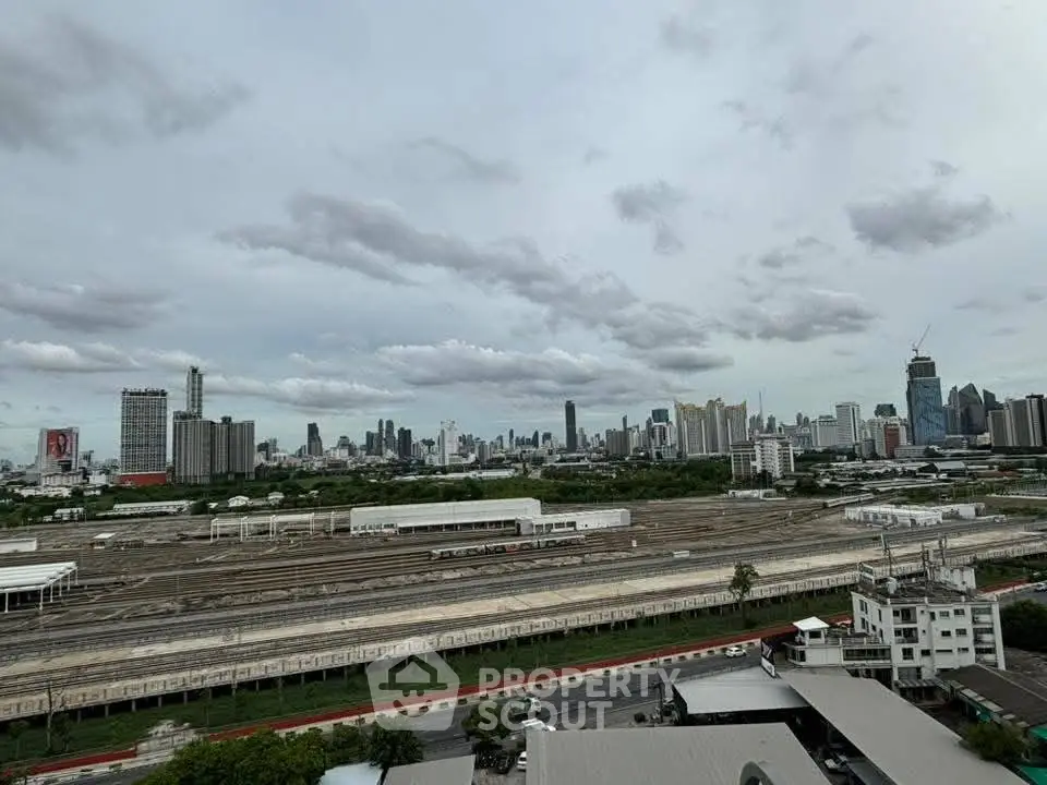 Stunning cityscape view with skyline and railway tracks, perfect for urban living enthusiasts.